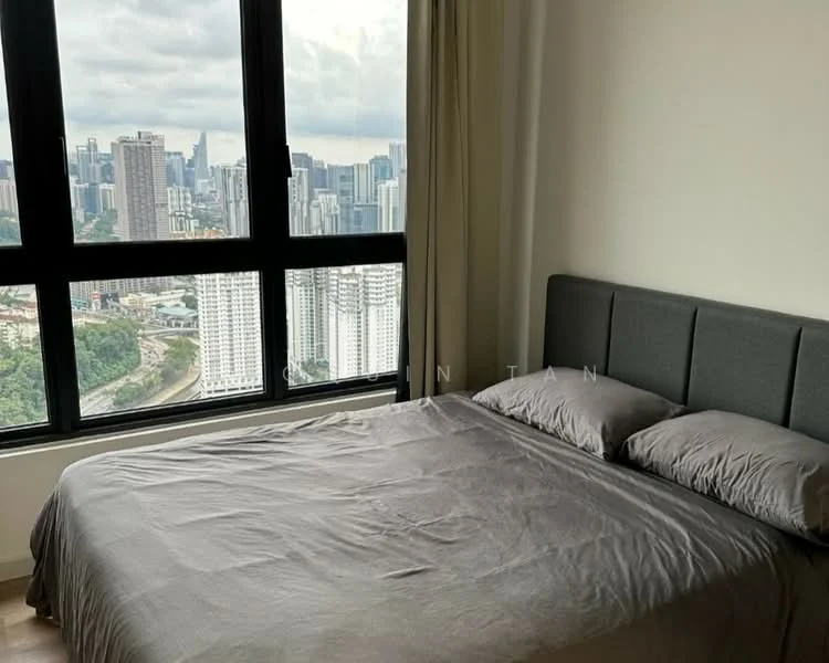 Bedroom features: king-size bed with grey upholstered headboard, floor-to-ceiling windows, city skyline view, light grey bedding, wooden flooring, curtains, minimalist decor, neutral wall color; style: modern; view: city.
