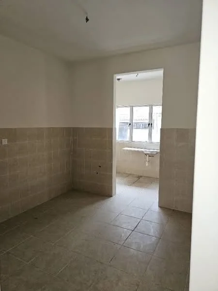 Room features: white painted walls, light beige tiled walls, ceramic tile flooring, window with multiple panes, doorway leading to another room, plain ceiling, no visible fixtures or appliances.