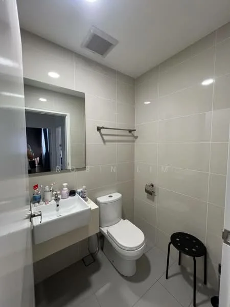 Bathroom features: white tiled walls, grey tiled flooring, single-sink vanity with cabinet, chrome basin mixer faucet, framed mirror, one-piece toilet, towel rack, wall-mounted toilet paper holder, LED ceiling light, black stool; style: modern.