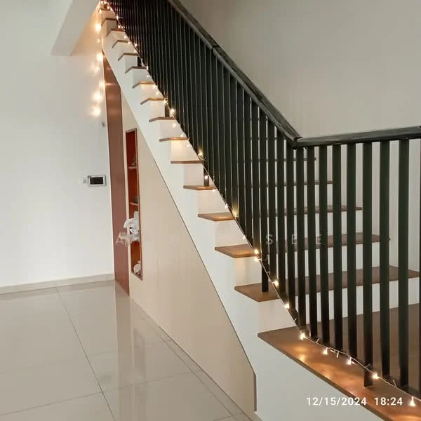 Room features: staircase with wooden steps, metal railing with vertical balusters, white painted walls, glossy tile flooring, decorative string lights along the staircase, built-in storage or shelving on the wall, neutral color scheme; style: modern.