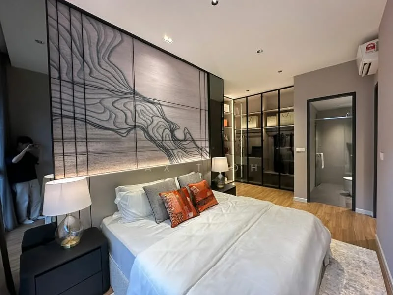 Bedroom features: king-size bed with white bedding, upholstered headboard, decorative pillows in orange, nightstands with lamps, wooden flooring, wall-mounted air conditioning unit, built-in wardrobe with glass doors, accent wall with abstract design, recessed ceiling lights, full-length mirror, en-suite bathroom door, grey painted walls; style: modern.
