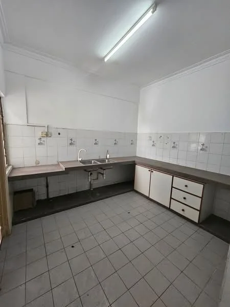 Kitchen features: white tiled walls, grey tiled flooring, single-bowl stainless-steel sink, chrome pull-down faucet, laminate countertop, white cabinetry with wooden handles, wall-mounted light fixture, window for natural light.