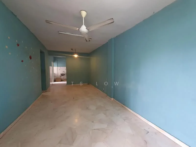 Room features: blue painted walls, marble flooring, 5-blade ceiling fan, single light fixture, open layout, no visible furniture, doorway leading to another room, light switch on wall.