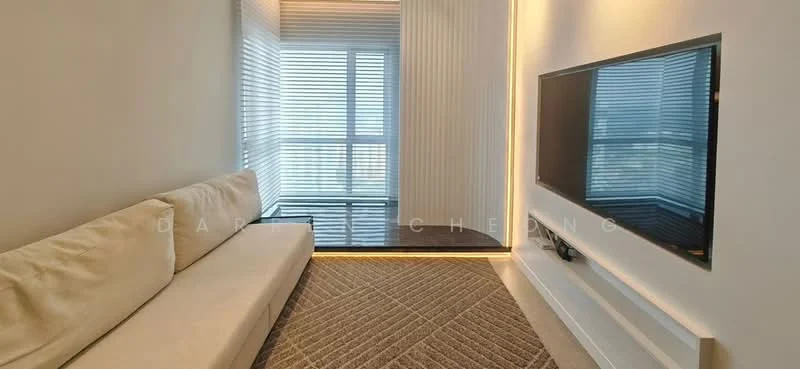 Living features: beige fabric sofa, wall-mounted TV, light wood paneling, recessed LED lighting, floor-to-ceiling windows, sheer window blinds, neutral wall color, textured area rug; style: modern; view: city.