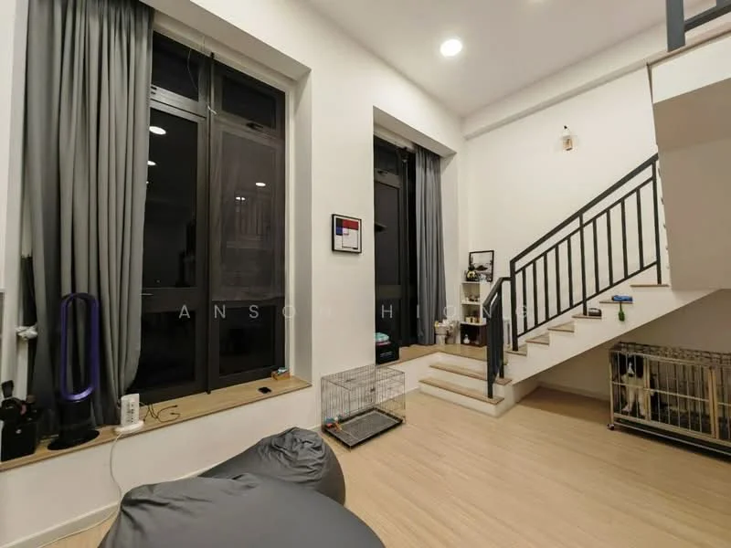 Living features: large windows with black frames, grey curtains, light wood flooring, white painted walls, staircase with black railing, bean bag chair, pet crate, wall-mounted artwork, decorative items on window sill; style: modern.