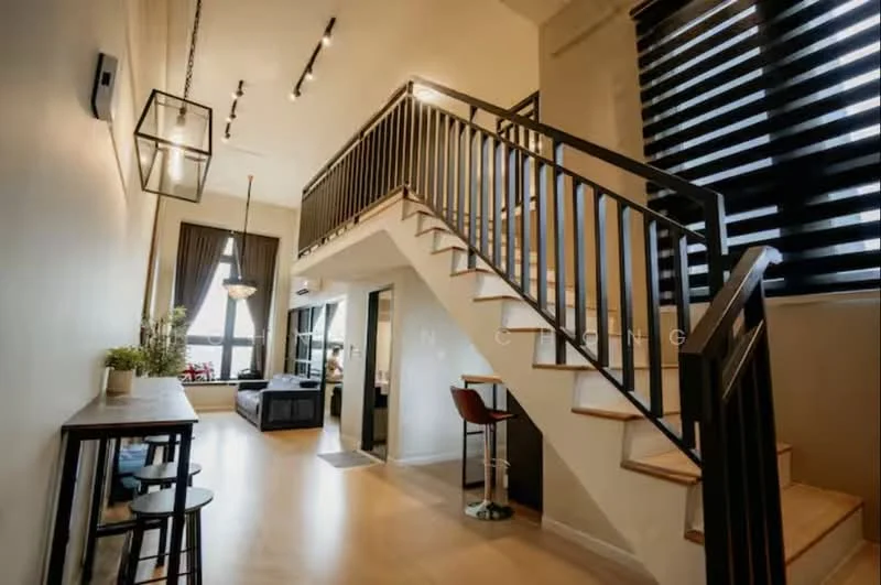 Living features: wooden flooring, high ceiling, large windows with black horizontal blinds, recessed ceiling lights, hanging pendant light, modern staircase with wooden steps and metal railing, sofa, coffee table, decorative plants, bar counter with stools; style: modern; view: city.