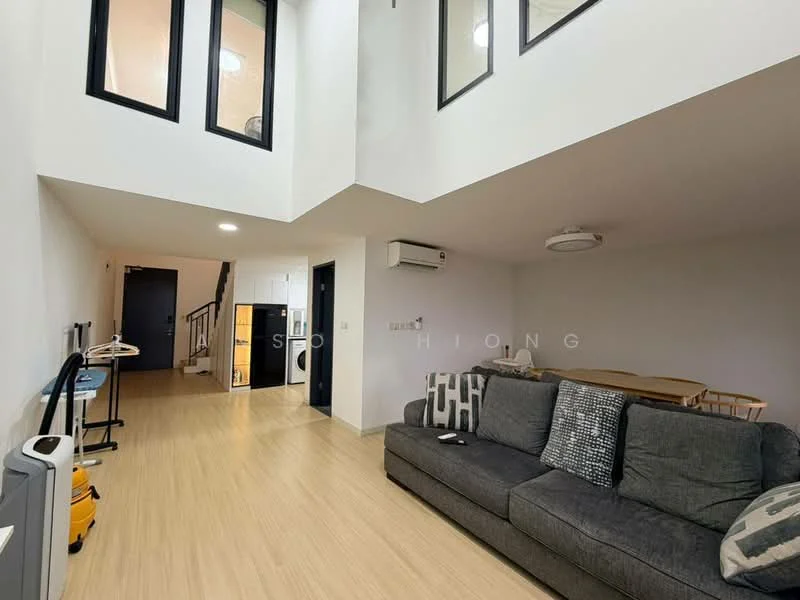 Living features: grey fabric sofa, wooden coffee table, laminate flooring, white painted walls, recessed downlights, ceiling-mounted air conditioning unit, floor-to-ceiling windows, black door, staircase leading to upper level; style: modern. Room features: kitchenette with white cabinetry, black appliances, open layout, dining table with chairs.