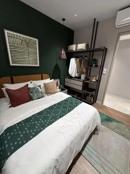 Bedroom features: queen-size bed with white bedding, green accent throw blanket, decorative pillows in various colors, wall-mounted artwork with green and white design, dark wood shelving unit, hanging storage baskets, built-in wardrobe, light-colored walls, wooden flooring, recessed ceiling lights, air conditioning unit; style: modern.