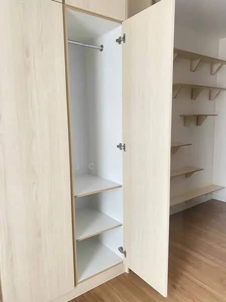 Room features: built-in wardrobe with sliding doors, light wood finish, open shelving, hanging rod for clothes, multiple shelves, laminate flooring; style: modern.