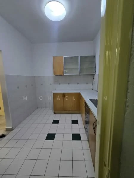 Kitchen features: white tiled walls, light grey tiled flooring, wood cabinetry with a natural finish, glass-front upper cabinets, white countertop, stainless-steel sink, built-in stove, overhead light fixture, green accent tiles on the floor.