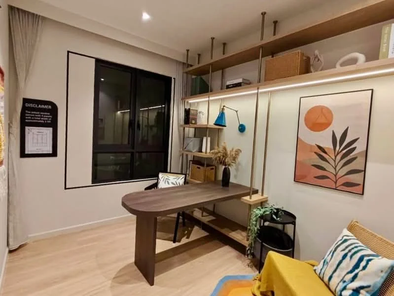 Study features: wooden desk, blue pendant light, open shelving with decorative items, framed artwork on wall, floor-to-ceiling window, curtains, wooden flooring, decorative plants, colorful area rug, black storage cart; style: modern.