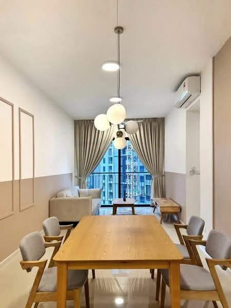 Dining features: wooden dining table, 4 upholstered dining chairs in grey, pendant light fixture with multiple globes, floor-to-ceiling windows, sheer curtains, cream painted walls, accent wall in light brown, wall-mounted split AC, polished tile flooring, sofa in light fabric, side table, decorative wall panels; style: modern; view: city.