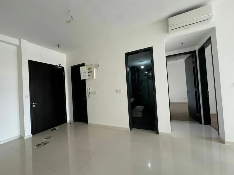 Room features: white painted walls, glossy tile flooring, black doors, air conditioning unit, recessed ceiling lights, open layout, doorway to adjacent rooms; style: modern.