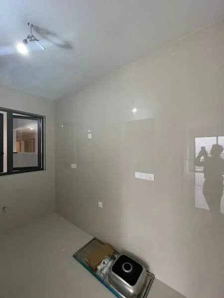Room features: white painted walls, glossy tile flooring, single-bowl stainless-steel sink, ceiling light fixture, window with black frame, shadow of a person on the wall.