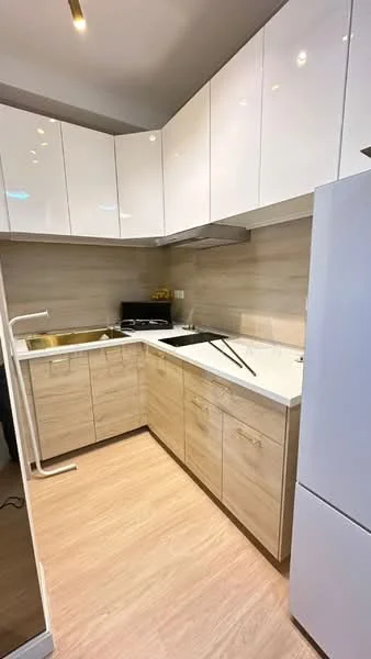 Kitchen features: L-shaped kitchen layout, white high-gloss upper cabinets, light wood lower cabinets, white quartz countertop, stainless-steel sink, chrome pull-down faucet, built-in stove, built-in oven, refrigerator, wood-look vinyl flooring, under-cabinet lighting, neutral wall color, tile backsplash; style: modern.