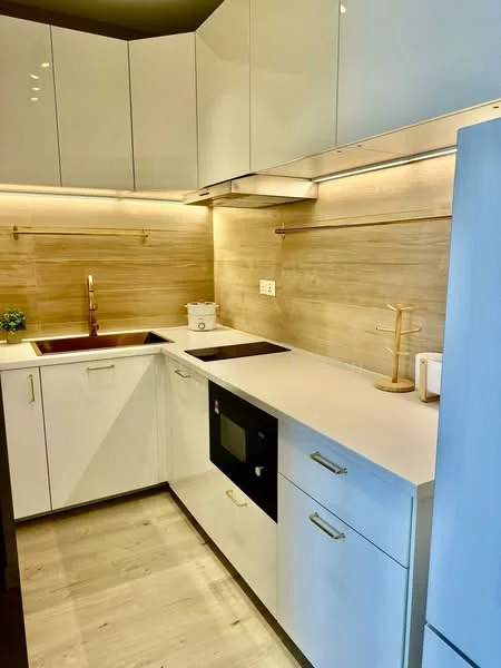 Kitchen features: white cabinetry with flat-panel doors, light wood backsplash, quartz countertop, single-bowl stainless-steel sink, chrome pull-down faucet, built-in microwave, induction cooktop, under-cabinet lighting, drawer storage, open shelving, light wood flooring, recessed downlights; style: modern.