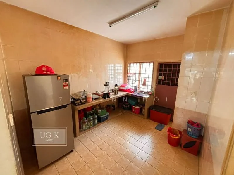 Kitchen features: ceramic tile flooring, beige painted walls, single-door fridge, wood countertop, sink, kitchen cabinets, window with grid, various storage containers, red plastic baskets, kettle, blender.