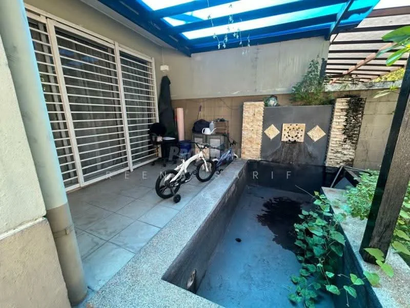 Room features: concrete flooring, sliding glass door, gravel landscaping, water feature with stone cladding, potted plants, metal roof awning, outdoor seating area, bicycle; style: modern; view: garden.