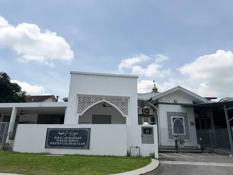 Exterior features: white painted facade, decorative lattice work, flat roof, single-storey, manicured lawn, parking area, security gate, visible air conditioning units; style: modern.