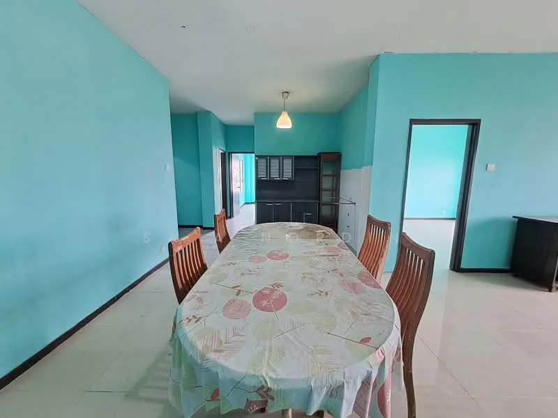 Dining features: oval dining table with floral tablecloth, wooden dining chairs, turquoise painted walls, light fixture hanging from ceiling, tile flooring, open layout to adjacent kitchen, built-in cabinet in background, doorway leading to another room.