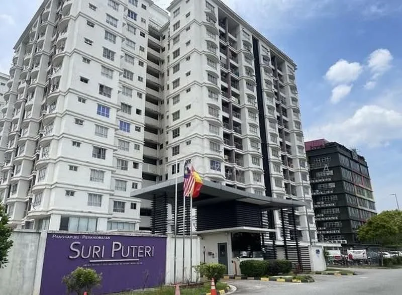 Exterior type: mid-rise condominium; features: white painted facade, glass curtain wall, double-volume main lobby, feature water wall, surrounded by mature greenery, flag poles with national flags, parking area in front, entrance with security gate; style: modern.