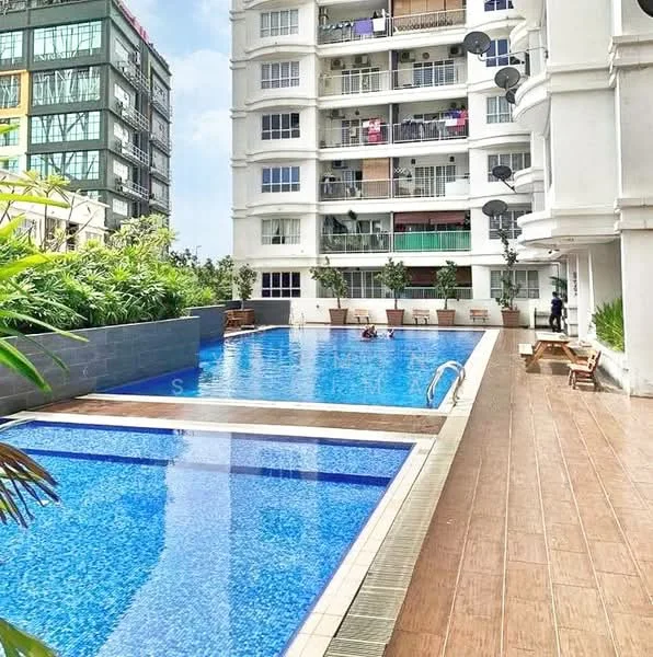 Exterior type: high-rise condominium; features: infinity pool, pool deck with loungers, landscaped garden, balconies with glass railings, multiple air conditioning units on balconies, surrounding greenery, wooden decking around pool, modern architectural design; style: modern.