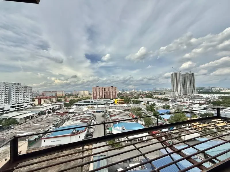 Exterior features: city skyline view, multiple high-rise buildings, industrial area with warehouses, cloudy sky, open balcony railing, urban landscape; style: modern.