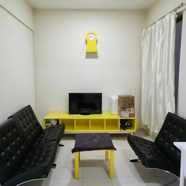 Living features: black leather sofa, yellow coffee table, yellow TV console, wall-mounted TV, white curtains, clock on wall, white walls, tile flooring; style: modern.