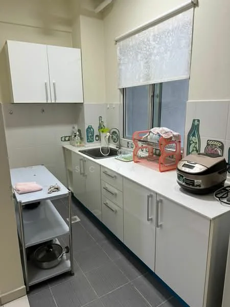 Kitchen features: white cabinetry with flat-panel doors, white countertop, stainless-steel sink, chrome faucet, built-in rice cooker, kitchen cart on wheels, tile backsplash with decorative pattern, window with sheer curtain, grey floor tiles, wall-mounted storage with decorative bottles, appliances visible on countertop; style: modern.