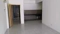 Room features: white painted walls, glossy tile flooring, kitchen cabinetry with dark wood finish, open layout, doorway leading to another room, countertop with backsplash, no visible appliances, neutral color scheme; style: modern.