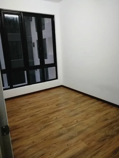 Room features: white painted walls, laminate flooring, floor-to-ceiling windows, black window frames, no visible furniture; style: modern.