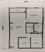 Floor plan: 2-bedroom 1-bathroom unit; features: open-plan kitchen-dining-living, master bedroom with ensuite bathroom, bedroom 2 with shared bathroom, utility room, central foyer.