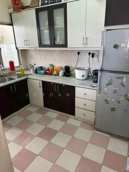 Kitchen features: white upper cabinets, dark wood lower cabinets, stainless-steel fridge, white countertop, sink with faucet, electric kettle, rice cooker, various kitchen utensils, checkered tile flooring in pink and white, wall-mounted electrical outlets, window with natural light; style: modern.
