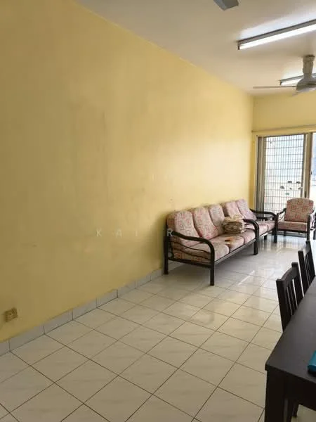Living features: yellow painted walls, white tiled flooring, 3-seater sofa with floral upholstery, 2-seater sofa with floral upholstery, dining table with chairs, ceiling fan, large window with grid, natural light from window.