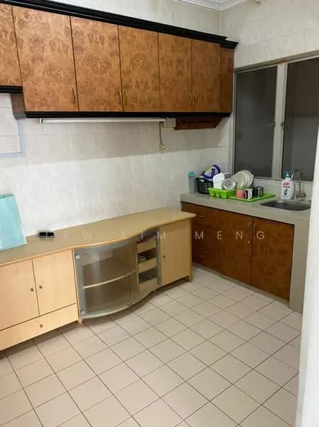 Kitchen features: wood cabinetry with brown finish, white tiled walls, light-colored countertop, stainless-steel sink, single-bowl sink, chrome faucet, built-in cabinet with glass doors, window with grid pattern, tile flooring, dish rack, various kitchen utensils, countertop with dishes.