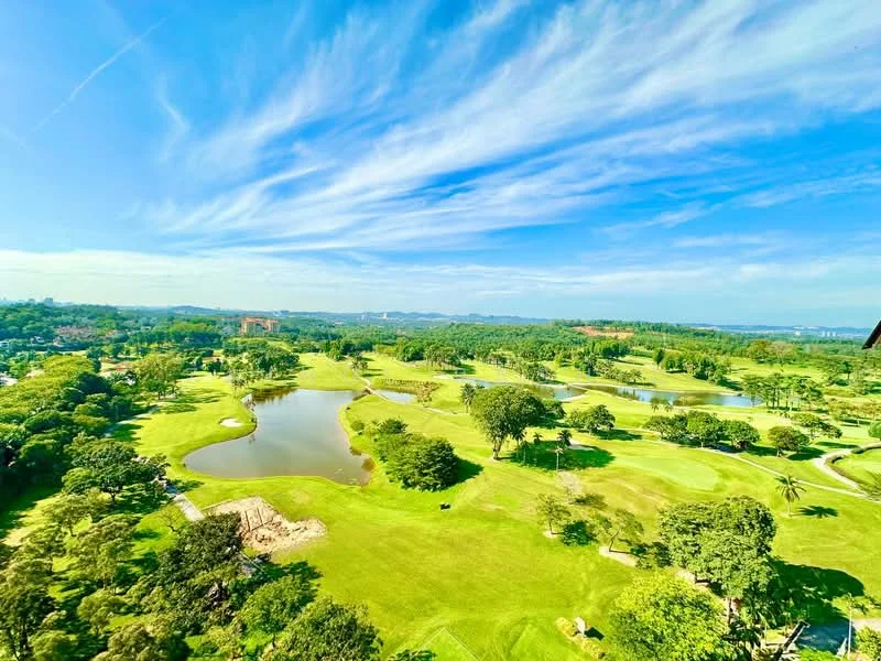 Exterior features: expansive golf course view, lush green landscaping, water bodies, mature trees, clear blue sky, scenic horizon; style: natural.