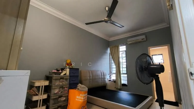 Bedroom features: light grey painted walls, white ceiling, 5-blade ceiling fan, floor-to-ceiling window with sheer curtains, queen-size bed with upholstered headboard, black bed frame, wooden flooring, built-in wardrobe, standing fan, decorative items on bedside table, storage boxes, area rug; style: modern.