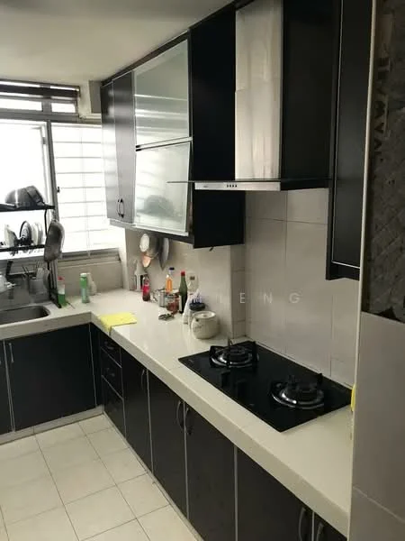 Kitchen features: black cabinetry, white countertop, double-burner gas hob, stainless-steel range hood, sink with faucet, tile backsplash, white tiled flooring, window with sheer curtains, kitchen utensils on countertop, bottles and condiments on countertop; style: modern.