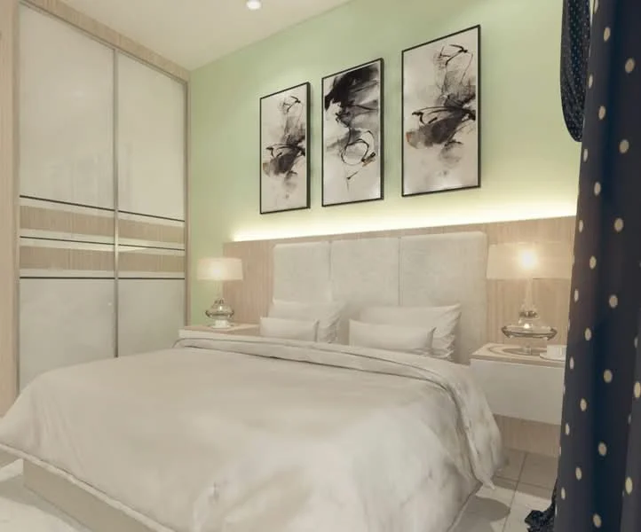 Bedroom features: king-size bed with upholstered headboard, white bedding, two bedside lamps with glass bases, framed artwork on walls, light green painted walls, built-in wardrobe with sliding doors, white bedside tables, recessed lighting, tile flooring; style: modern.