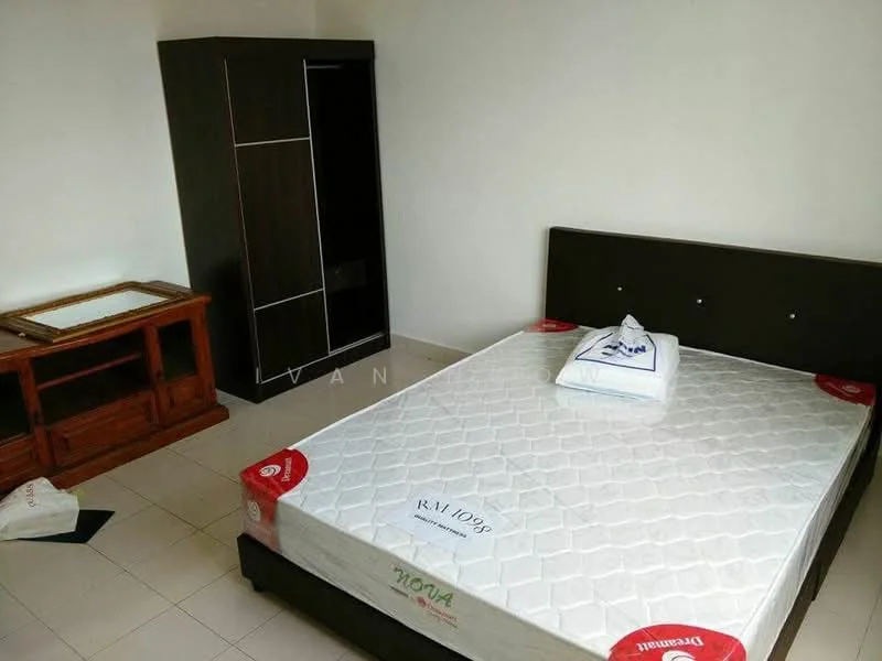 Bedroom features: queen-size bed, mattress with protective cover, wooden wardrobe, wooden side table, cream painted walls, tile flooring, no visible window treatments, minimal decor; style: minimalist.