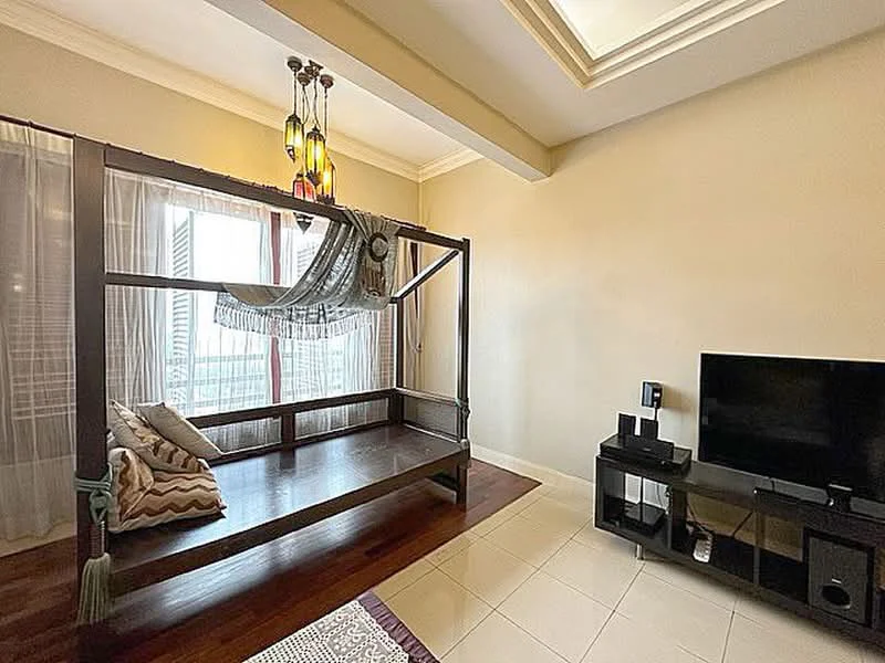 Living features: four-poster bed with canopy, wooden flooring, white painted walls, recessed ceiling with crown moulding, large windows with sheer curtains, TV console in black, wall-mounted TV, decorative cushions, area rug with geometric pattern, pendant lighting with multiple bulbs; style: modern; view: city.