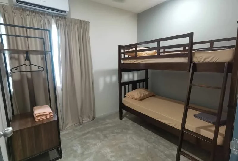 Bedroom features: bunk bed with wooden frame, single mattress on top bunk, single mattress on bottom bunk, grey accent wall, cream painted walls, curtains in beige, air conditioning unit on ceiling, wooden wardrobe with hanging space, concrete flooring; style: modern.