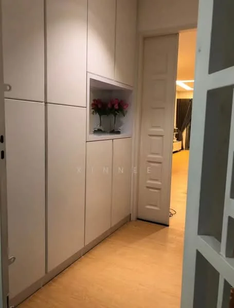 Room features: white cabinetry with flat-panel doors, built-in niche with decorative flowers, light wood flooring, white door with panel design, neutral wall color, recessed lighting, open doorway leading to another room; style: modern.