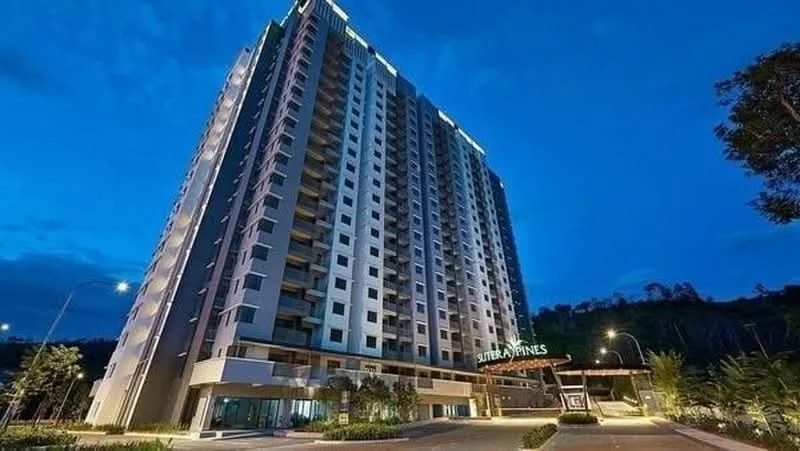 Exterior type: high-rise condominium; features: glass curtain wall, white painted facade, projecting balconies, feature lighting at night, manicured landscaping, driveway with interlocking pavers, double-volume main lobby, surrounded by mature greenery; style: modern.