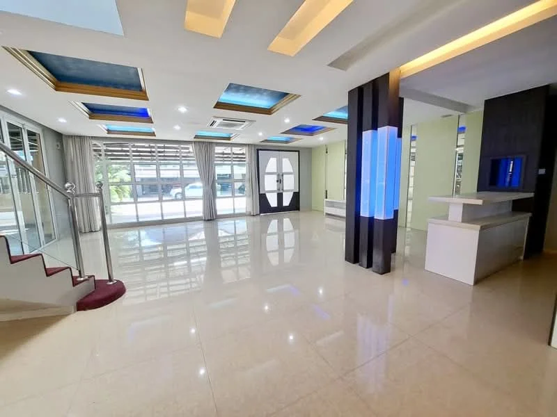 Living features: glossy marble tile flooring, tray ceiling with recessed lighting, blue LED accent lighting, large glass sliding doors, sheer curtains, open layout, staircase with carpeted steps, decorative wall paneling, built-in feature wall with lighting, air conditioning unit; style: modern; view: garden.