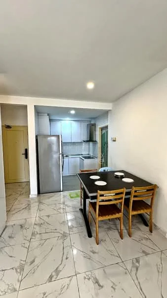 Dining features: dining table with four wooden chairs, white plates on the table, marble tile flooring, white painted walls, recessed downlights, stainless-steel fridge, kitchen cabinetry in white, open layout to kitchen area; style: modern.