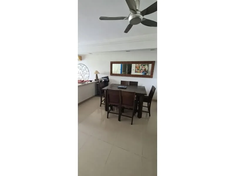 Dining features: 6-seater dining table, wooden dining chairs, ceiling fan, wall-mounted mirror, lampshade, light-colored walls, tile flooring, decorative artwork; style: modern. Kitchen features: kitchen counter, open layout to dining area; style: modern.
