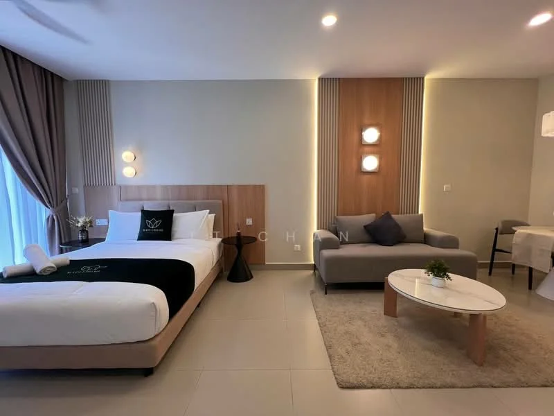 Bedroom features: queen-size bed with black and white bedding, upholstered headboard, 2 bedside lamps, sofa in grey fabric, coffee table with wooden legs, area rug with neutral color, floor-to-ceiling window with sheer curtains, wall-mounted light fixtures, wood panel accent wall, recessed lighting, cream painted walls, tile flooring; style: modern.