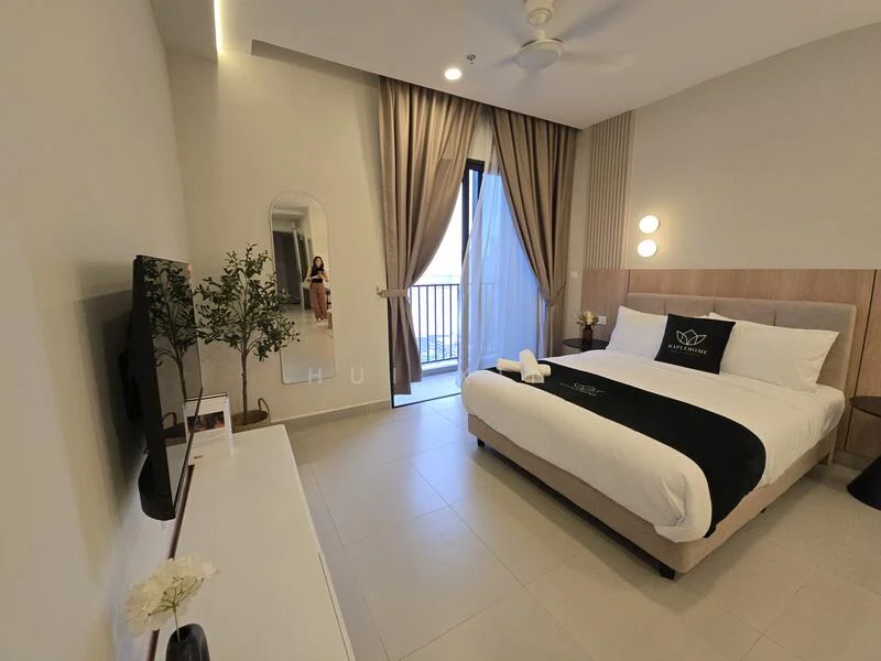 Bedroom features: king-size bed with upholstered headboard, white bedding with black accent throw, nightstands on either side of the bed, table lamps on nightstands, floor-to-ceiling windows with sheer curtains, balcony access through sliding glass door, wall-mounted TV, white dresser with minimalist design, decorative plant in ceramic pot, ceiling fan with light, neutral painted walls, tile flooring; style: modern; view: city.