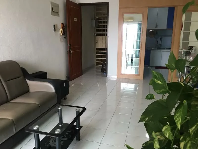 Living features: grey fabric sofa, black coffee table with glass top, white tiled flooring, white painted walls, mirror on wall, doorway leading to kitchen, potted plant, wall-mounted intercom, light fixture on ceiling; style: modern. Room features: white tiled flooring, white painted walls, doorway leading to bathroom, doorway leading to kitchen.